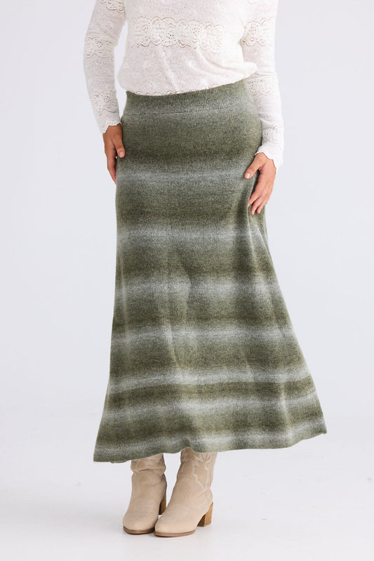 Model wearing Essence Knit Skirt in moss ombre with ombre knit design, front view on white background