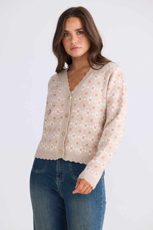 Close-up of Prairie Cardi in daisy beige showing V neckline and long sleeves, detail view on white background