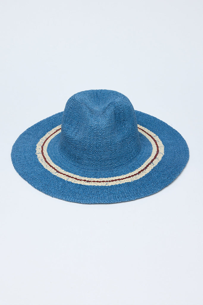 Blue straw hat with a decorative band on a white background