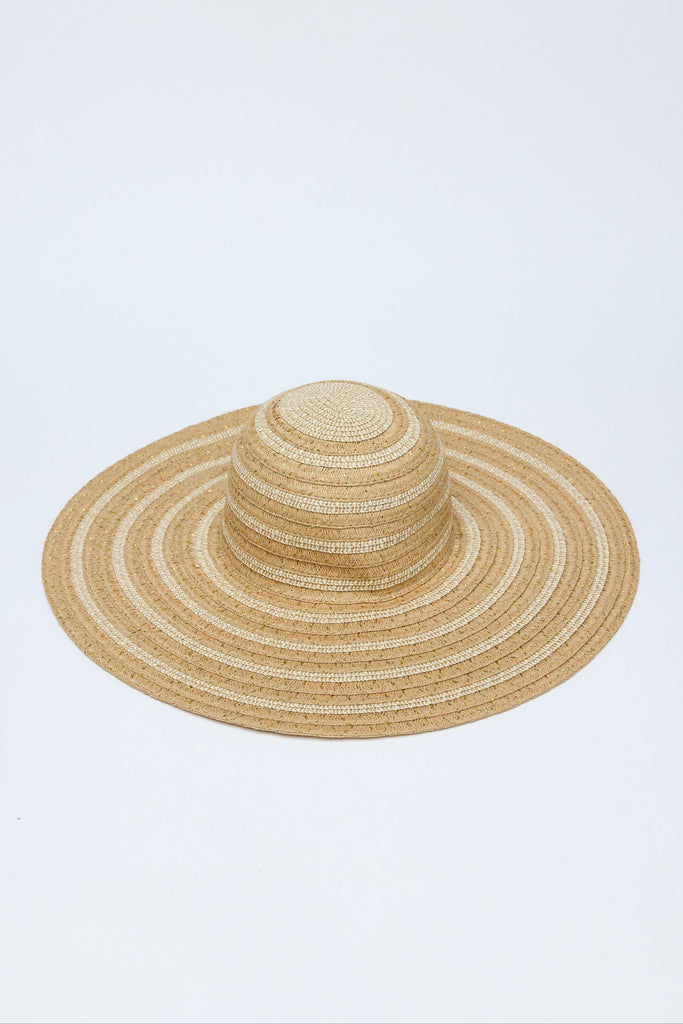 Beige straw hat on a light blue background