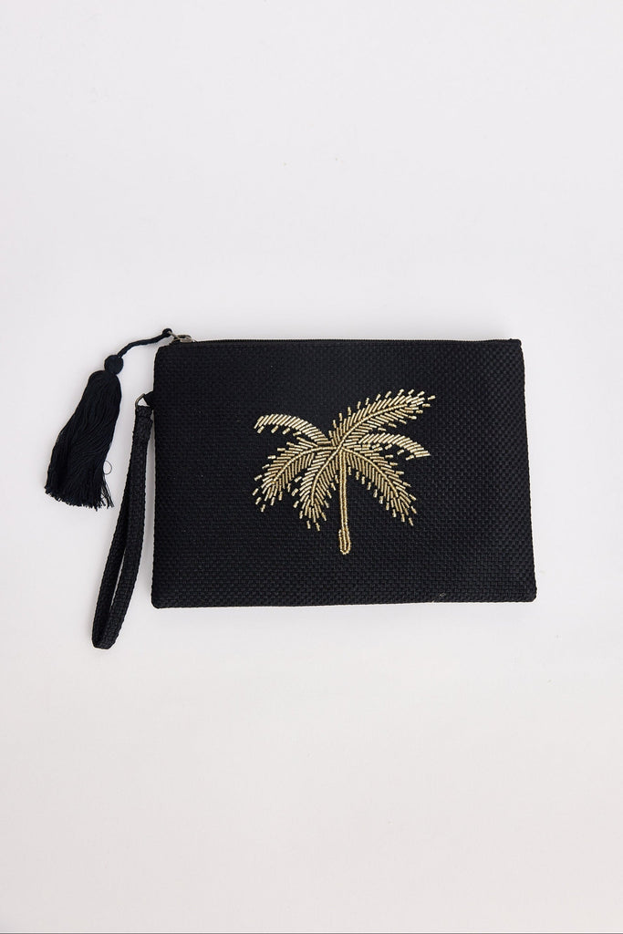 Black clutch with gold palm tree design on a white background
