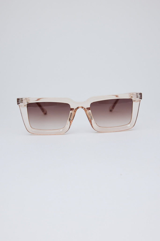 Sunglasses with a gradient lens on a light gray background