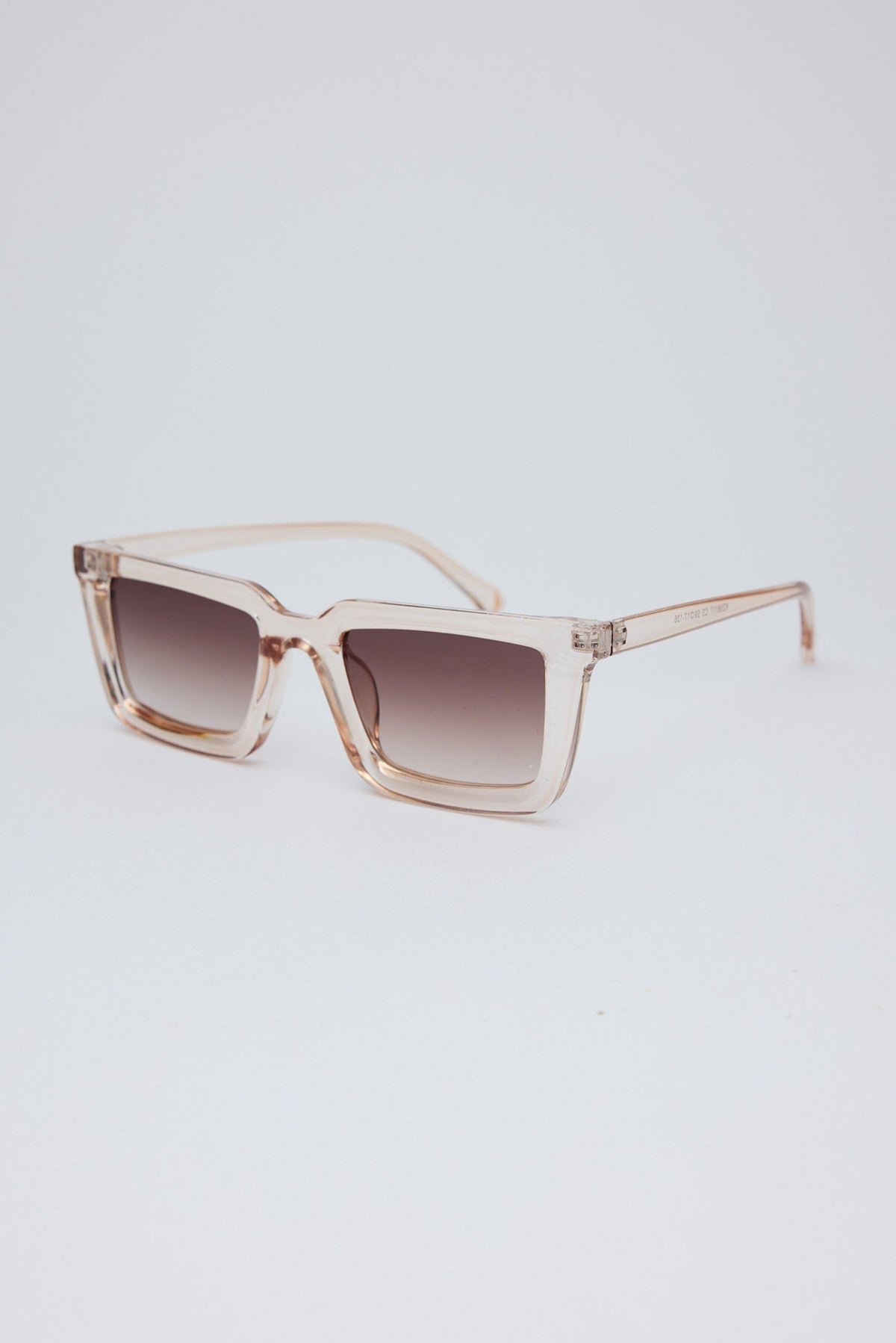 Angled view of Clear Coastline Sunglasses on white background