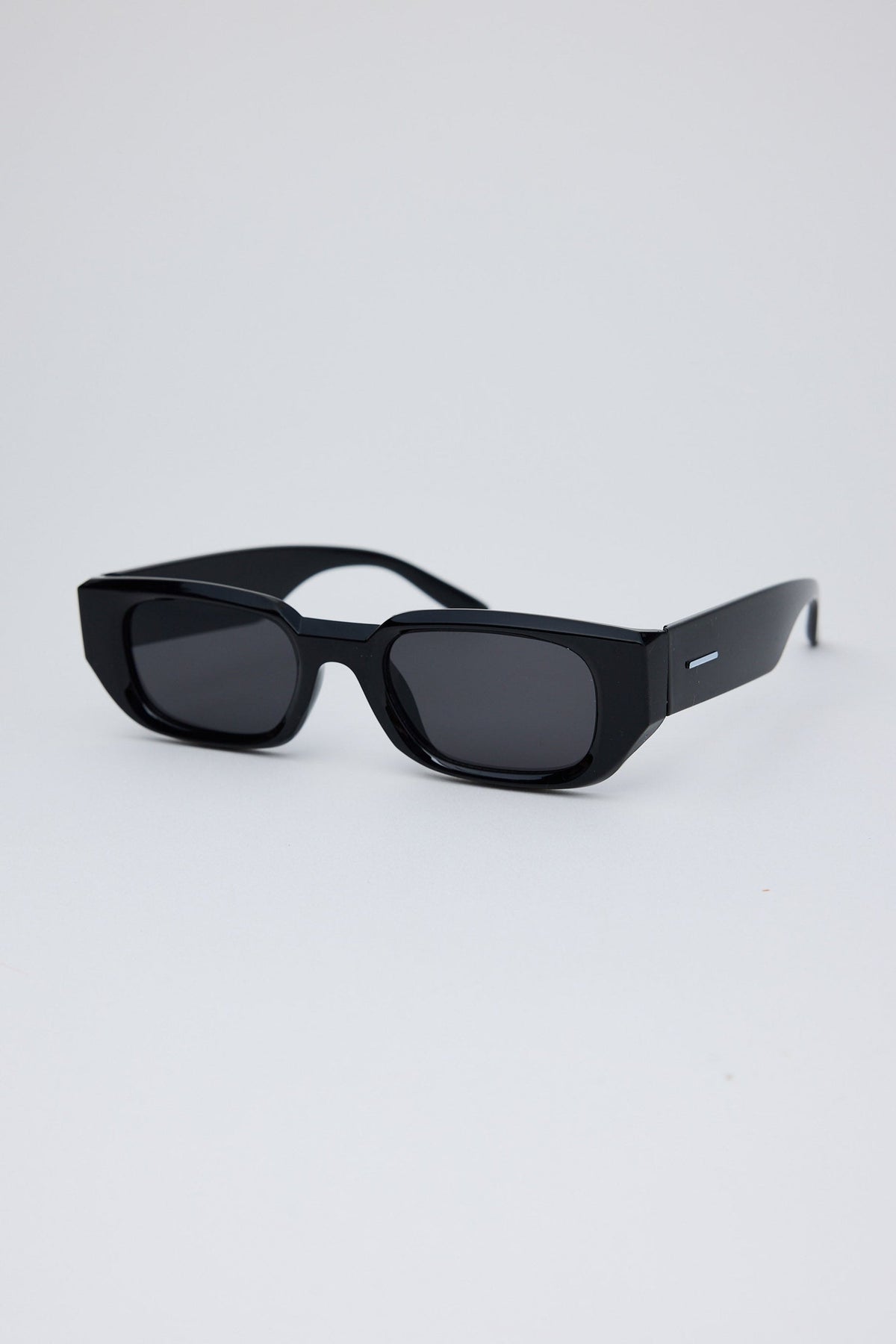 Angled view of Black Beverly Sunglasses on white background