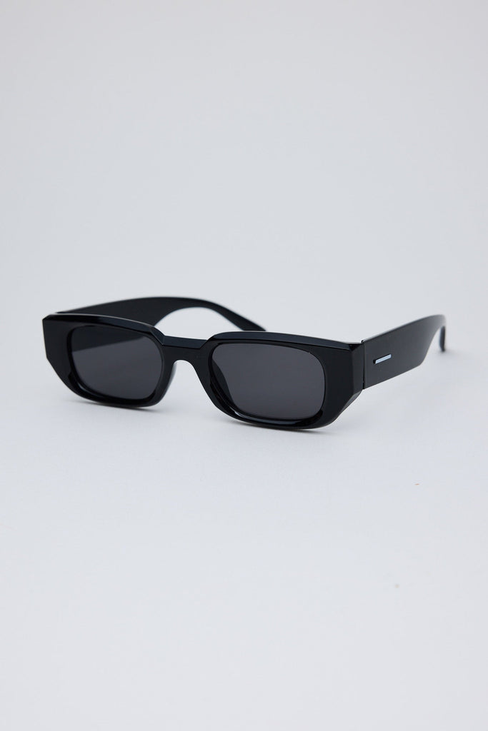 Black sunglasses on a light gray background