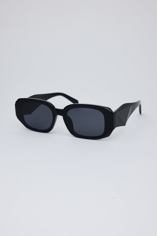 Angled view of Black London Sunglasses on white background