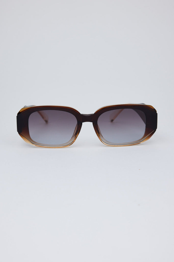 Sunglasses with a tortoiseshell frame on a white background