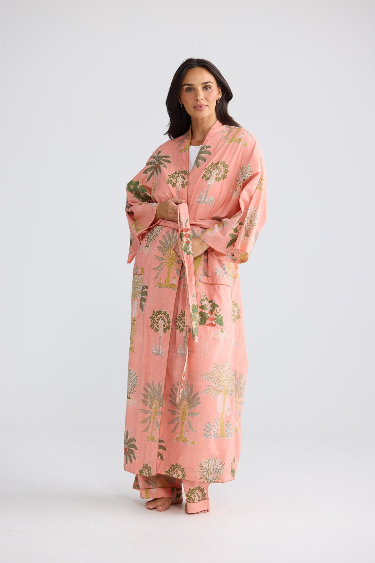 Namaste Robe in Baby Pink Palm with a waist tie.
