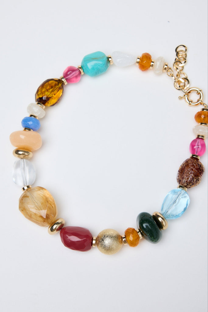 Multicolored beaded necklace on a white background