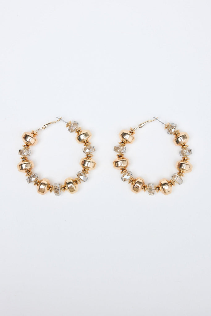 Gold hoop earrings with small beads on a white background