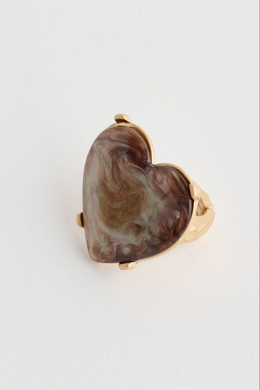Heart-shaped stone ring on a white background