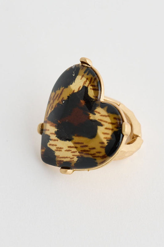 Heart-shaped tortoiseshell ring on a white background