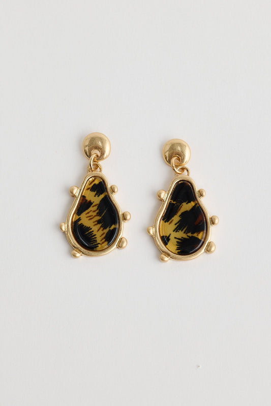 Pair of earrings with black and gold design on a white background