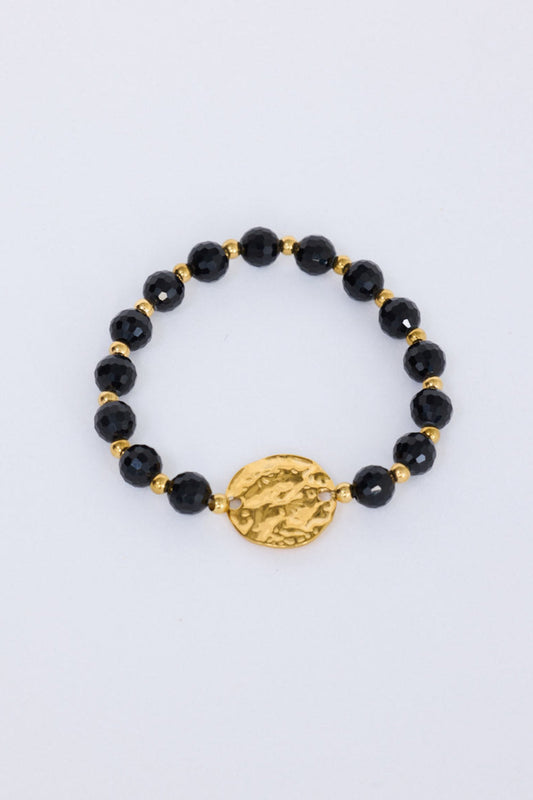 Taylor Bracelet in black with statement gold charm detail, front view on white background
