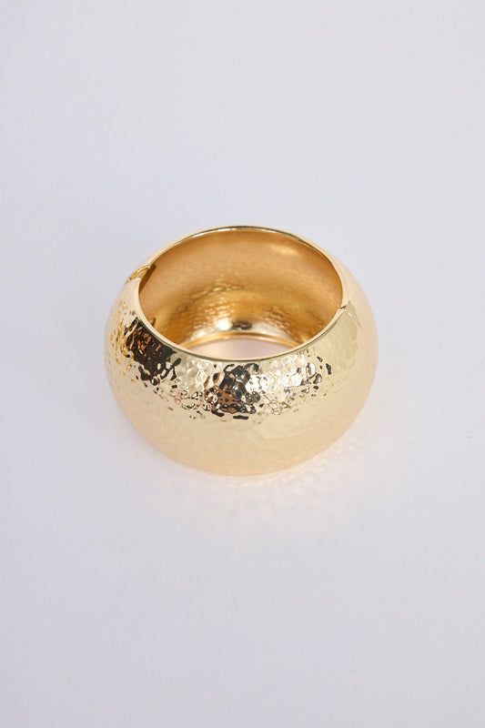 Maura Bangle in gold with snap lock closure and hinge for easy wear, texture detail view on white background