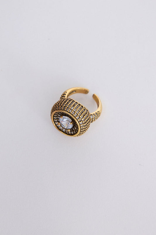Halo Ring in gold with central stone and textured band detailing, angled view on white background