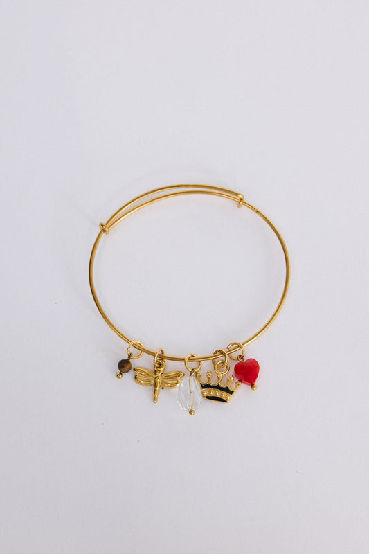 Crown Bracelet in gold with multiple charm detailing, front view on white background