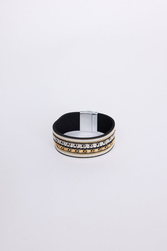 Ballina Bracelet in black with layered textures and embellished detailing, angled view on white background