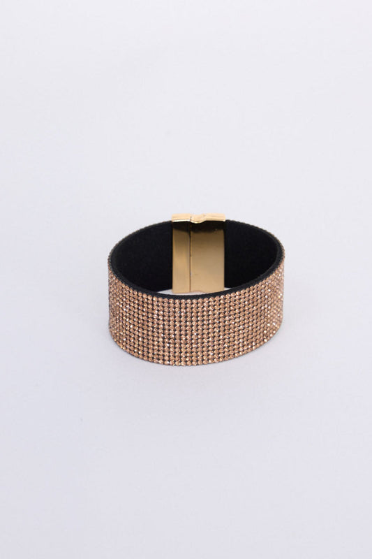 Rover Bracelet in gold with layered textures and embellished detailing, angled view on white background