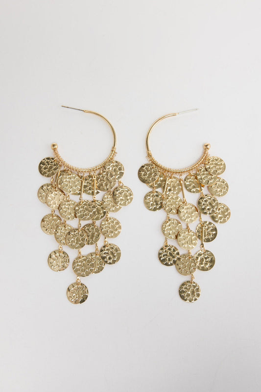 Pair of Arlo cascading disc earrings laid flat, showing rows of hammered gold-tone discs suspended from a hoop