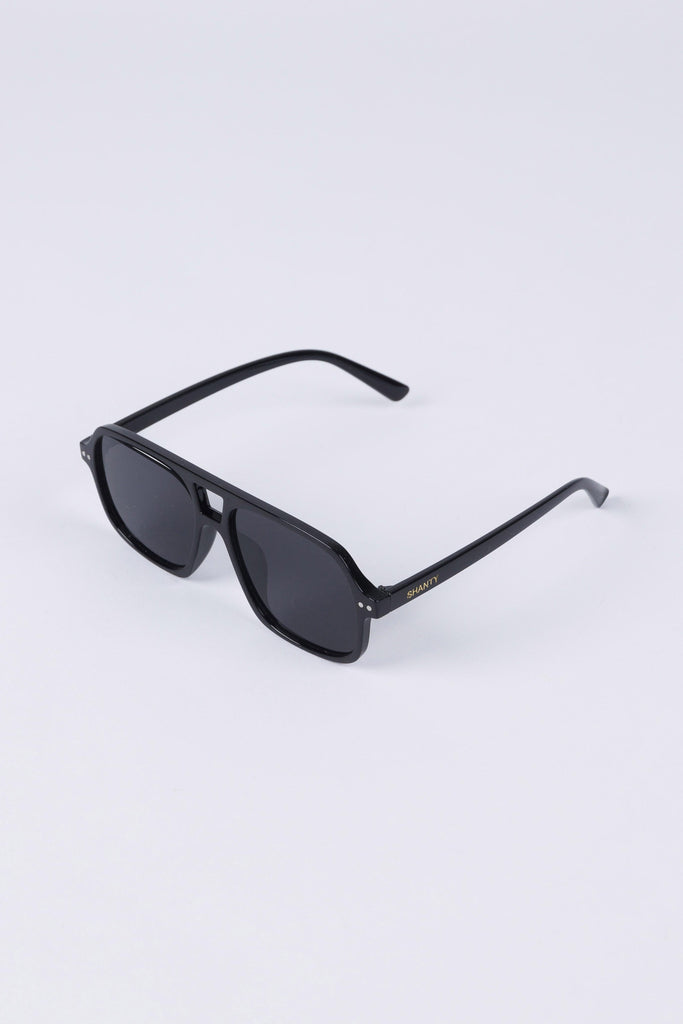 Black sunglasses on a light gray background