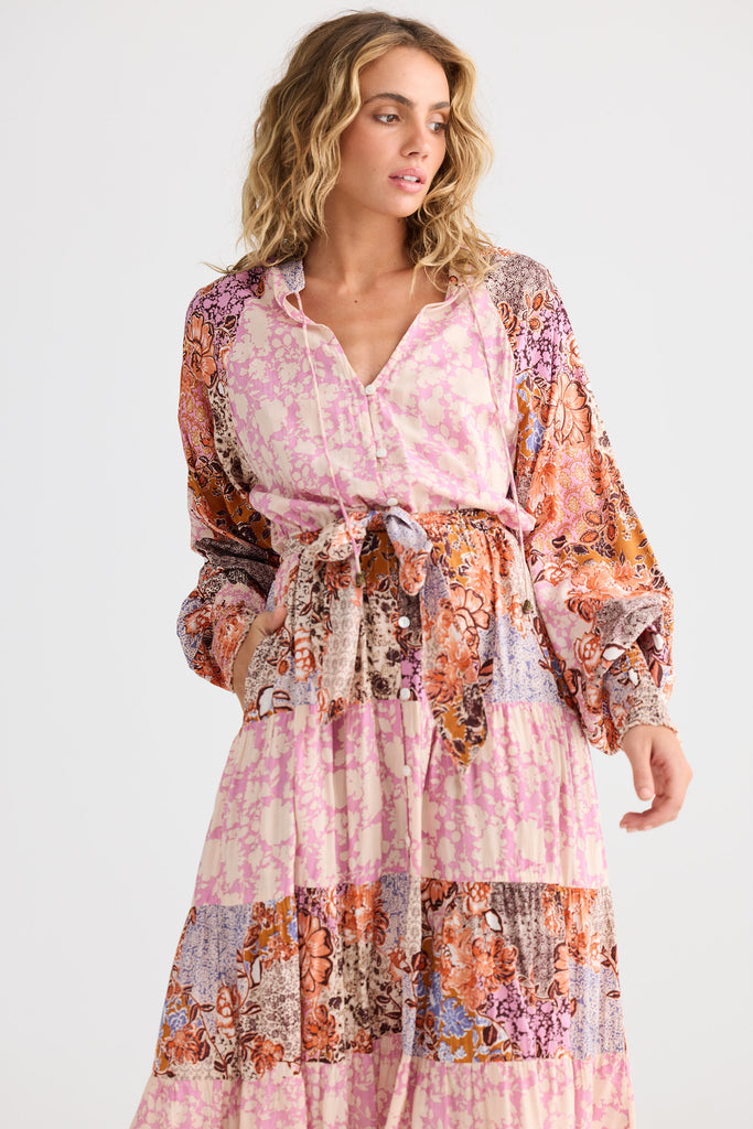 Woman wearing a floral dress with a white background