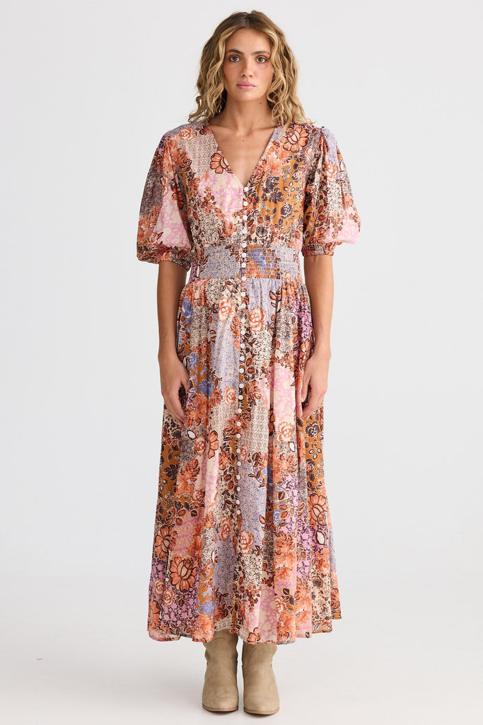 Woman wearing a floral dress on a white background