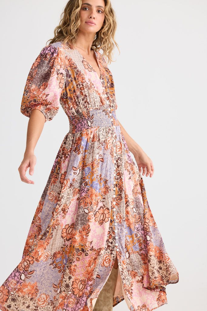 Woman wearing a floral dress on a white background