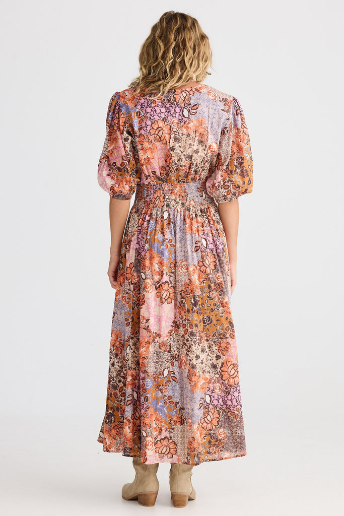 Woman wearing a floral dress on a white background