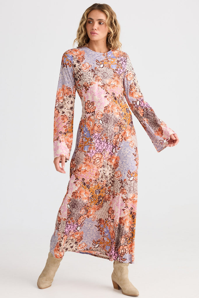 Woman wearing a floral dress on a white background