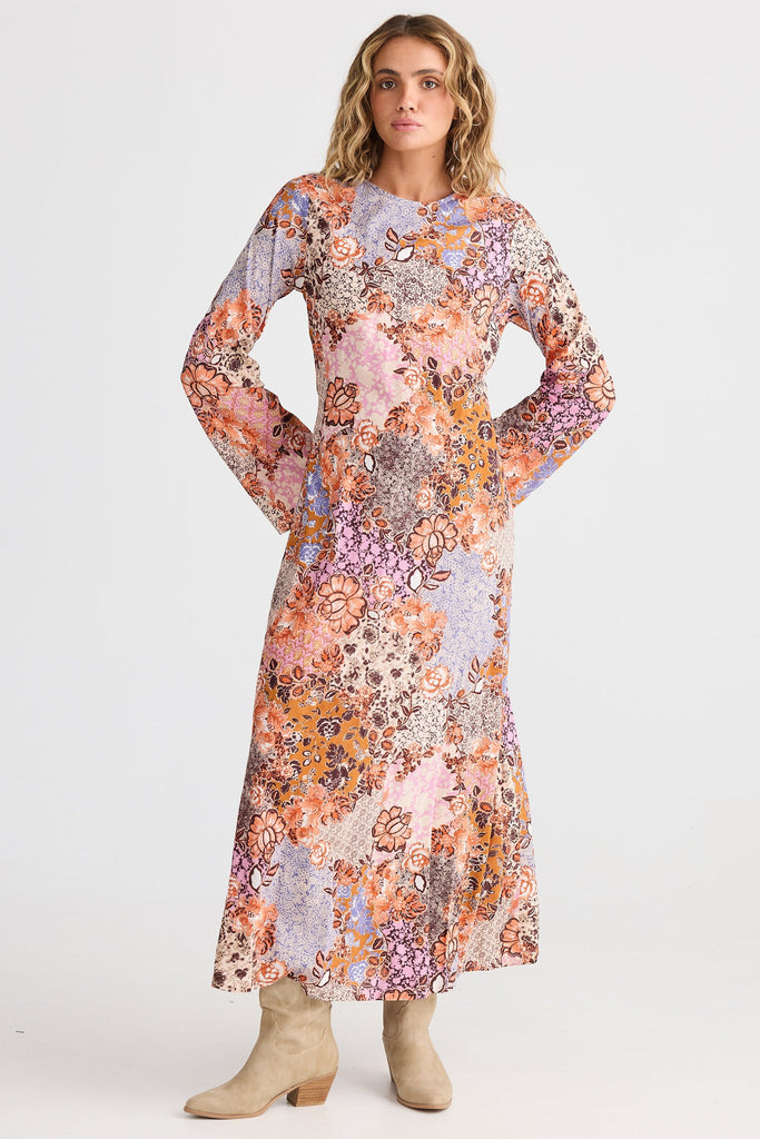 Woman wearing a floral dress on a white background