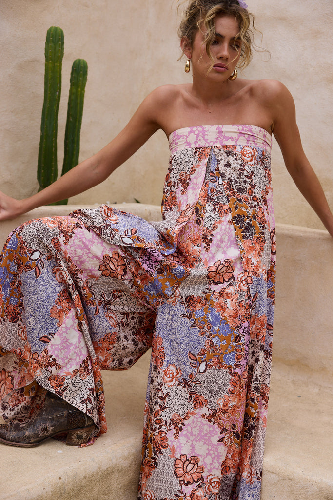 Woman wearing a floral dress with cacti in the background