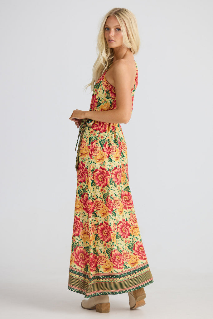 Woman wearing a floral dress on a white background