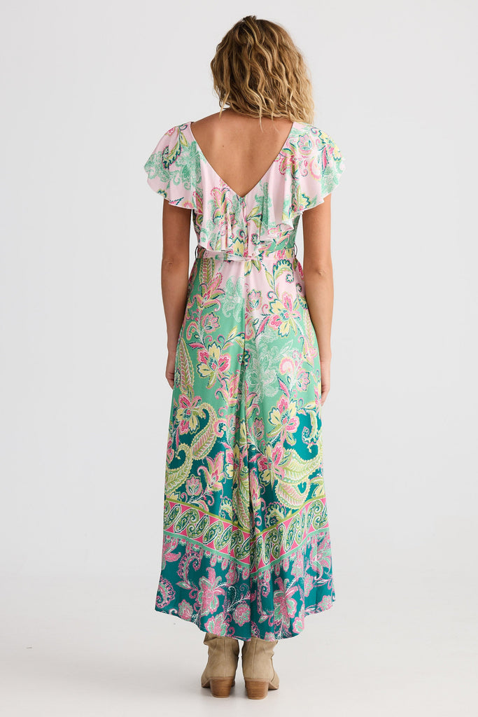 Woman wearing a floral dress with a white background