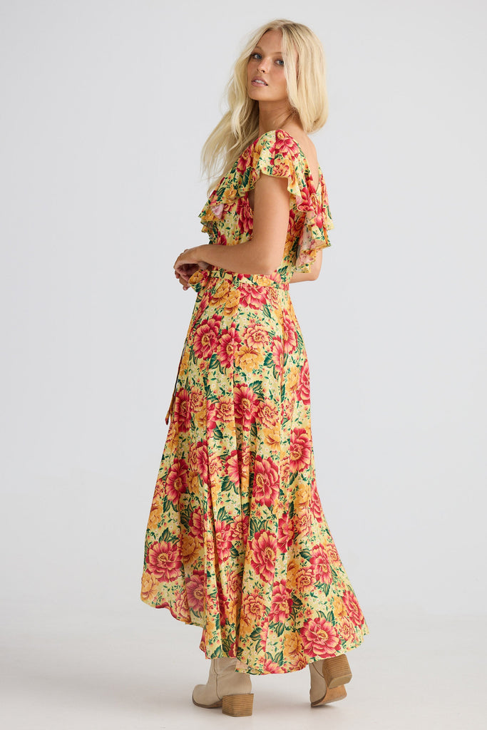 Woman wearing a floral dress on a white background