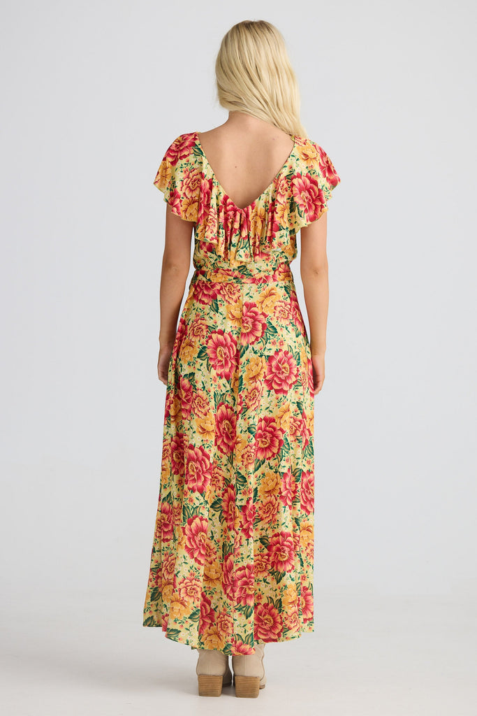 Woman wearing a floral dress on a white background