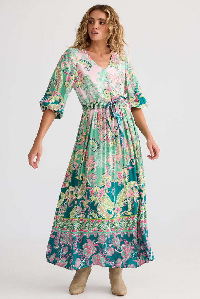 Woman wearing a floral dress on a white background