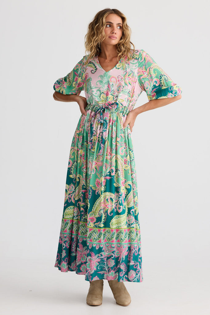 Woman wearing a floral dress on a white background