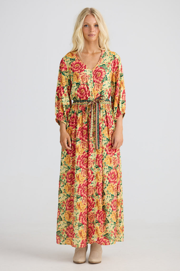 Woman wearing a floral dress on a white background