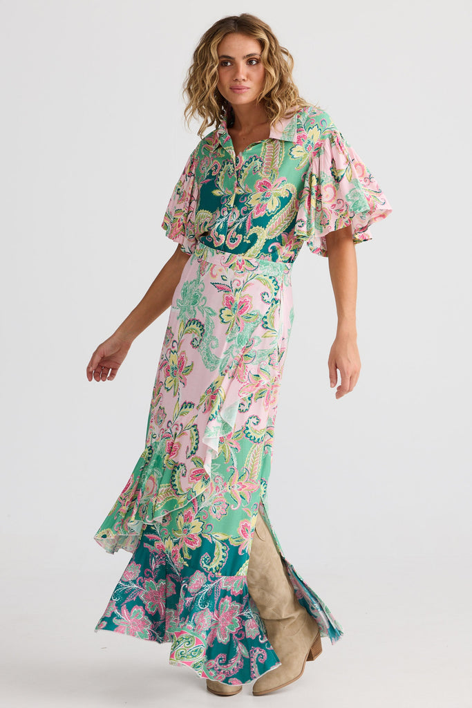 Woman wearing a floral dress on a white background