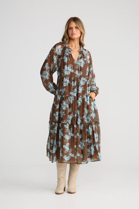 Woman wearing a floral dress on a white background