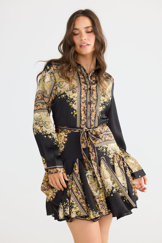 Model wearing Clove Dress in black paisley with classic two-piece collar, front view on white background