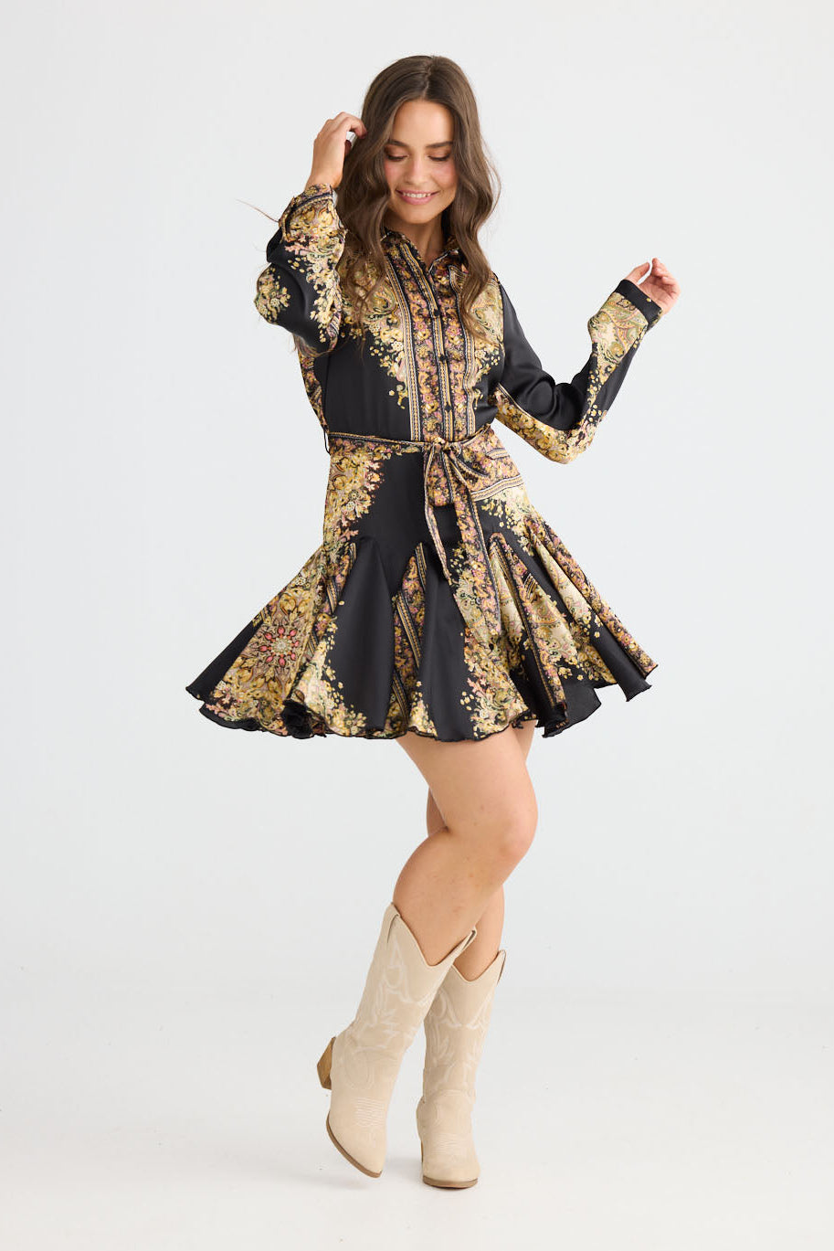 Model wearing Clove Dress in black paisley with classic two-piece collar, side view on white background