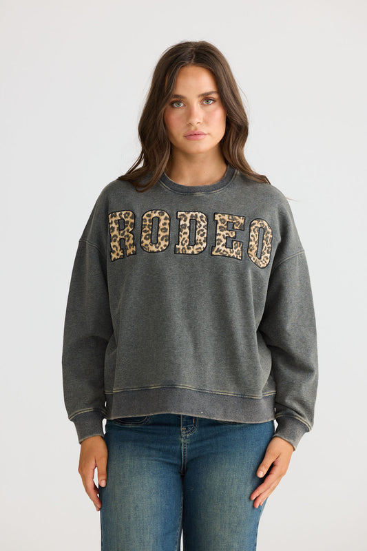 Model wearing Atmos Sweater in charcoal with crew neckline and long sleeves, front view on white background
