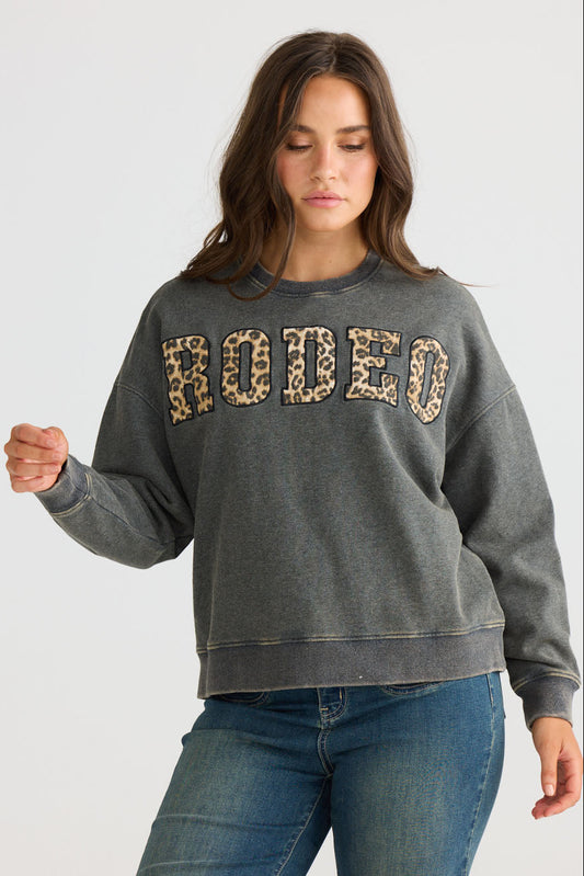 Close-up of Atmos Sweater in charcoal showing crew neckline and long sleeves, detail view on white background