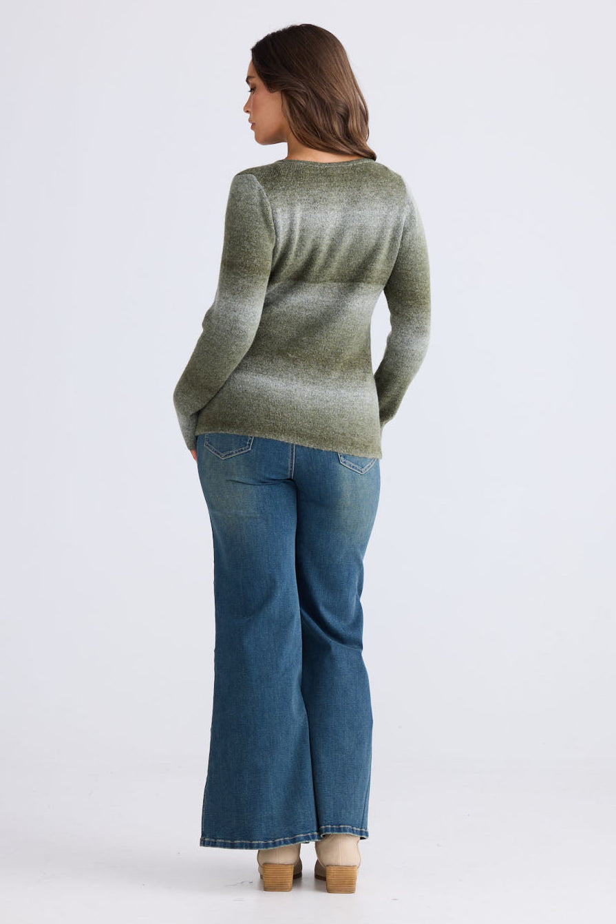 Model wearing Essence Knit Top in moss ombre with ombre knit design and long sleeves, side view on white background