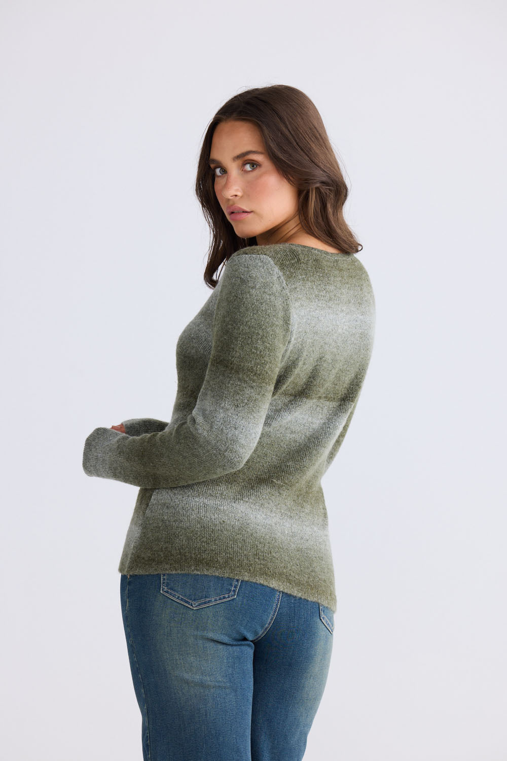 Model wearing Essence Knit Top in moss ombre with ombre knit design and long sleeves, front view on white background