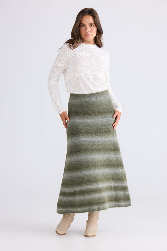 Model wearing Essence Knit Skirt in moss ombre with ombre knit design, back view on white background