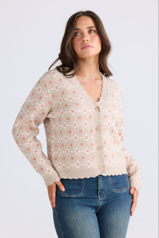 Model wearing Prairie Cardi in daisy beige with V neckline and long sleeves, front view on white background