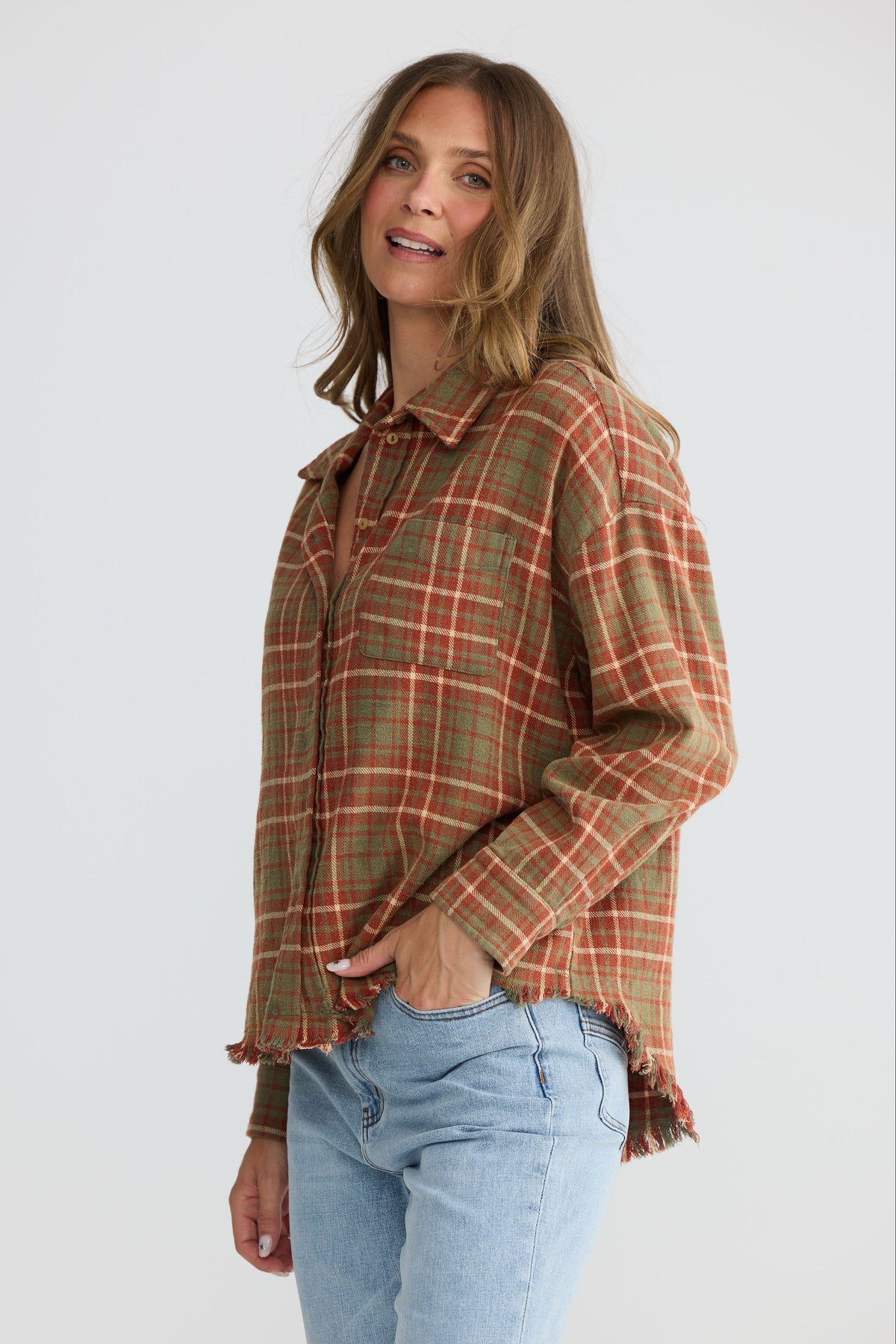 Model wearing Daytona Shirt in rust check with two-piece collar and long sleeves, front view on white background